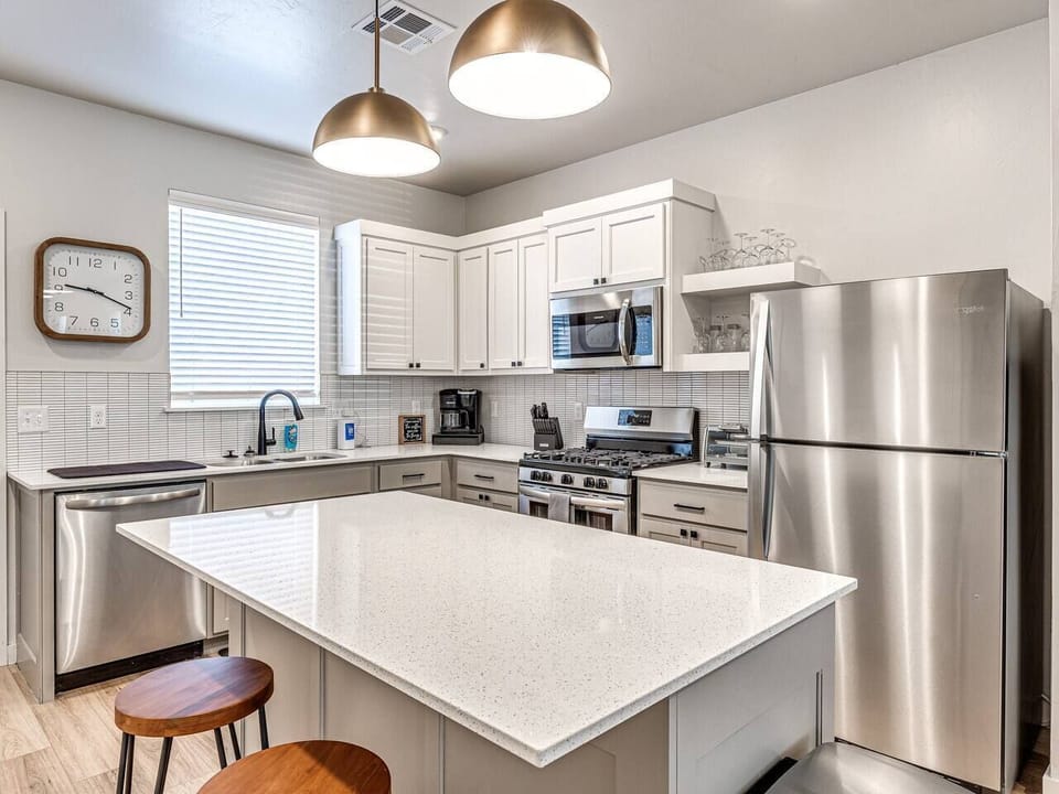 The heart of the home beats with a rhythm of comfort and style, where every corner is meticulously designed to foster relaxation and memorable gatherings.