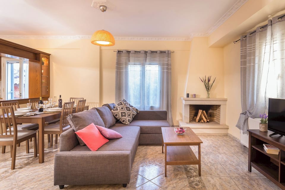 Cozy family room with fireplace. Open concept living space including kitchen, breakfast area, dining room, and family room.