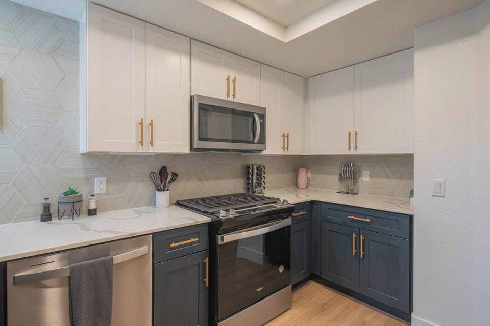 A bright, modern space where culinary creativity thrives, complete with sleek surfaces and welcoming warmth.