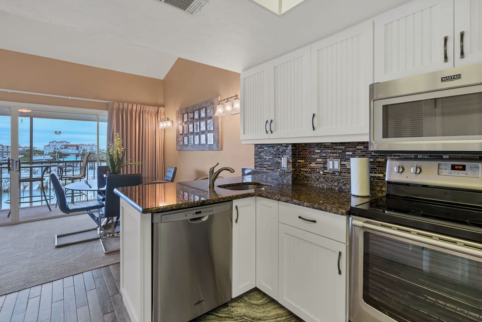 Equipped with dishwasher, microwave, stove, oven, toaster, blender and more. 