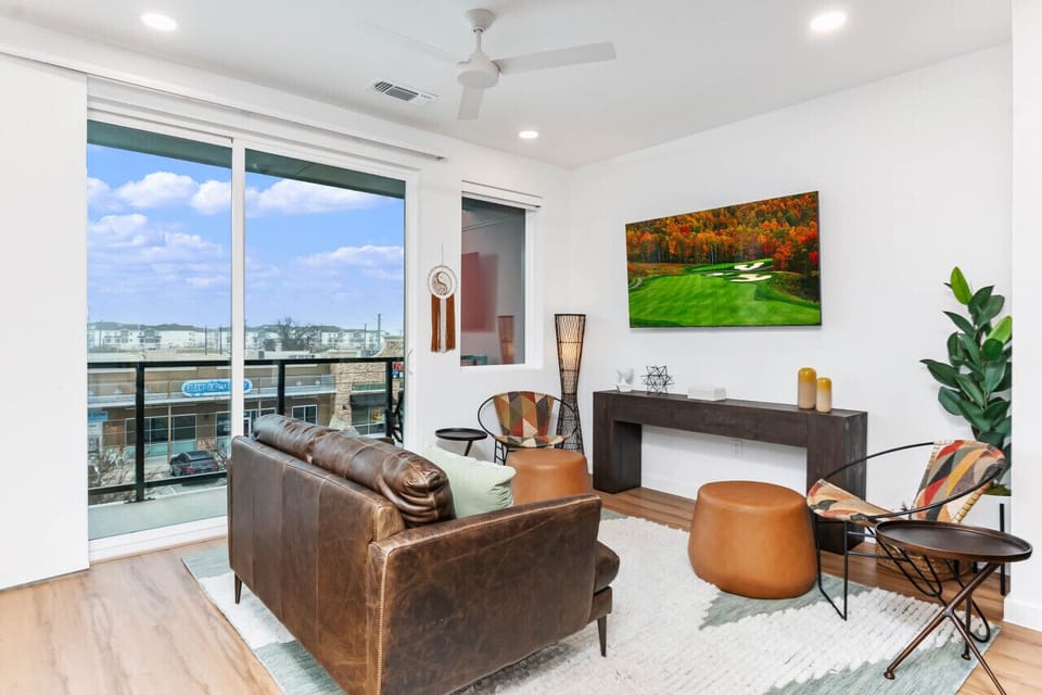 Spacious Living room area with views of nearby shops