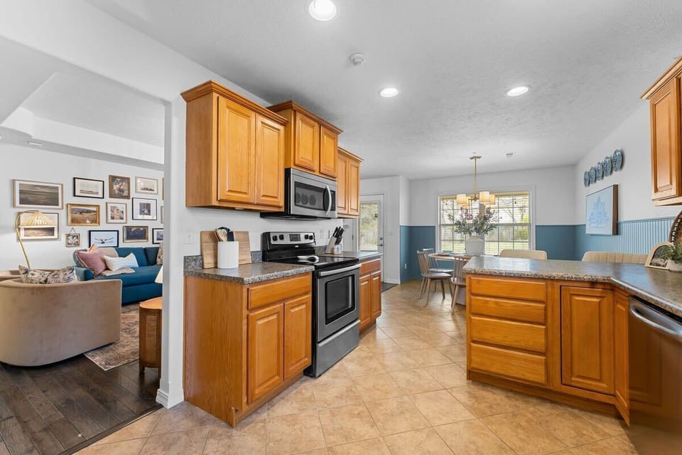 The fully stocked kitchen is located right next to the living room!