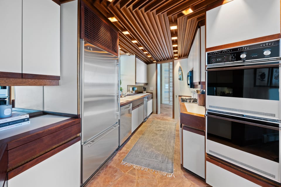 Custom cabinets & ceiling give the kitchen a casino feel.