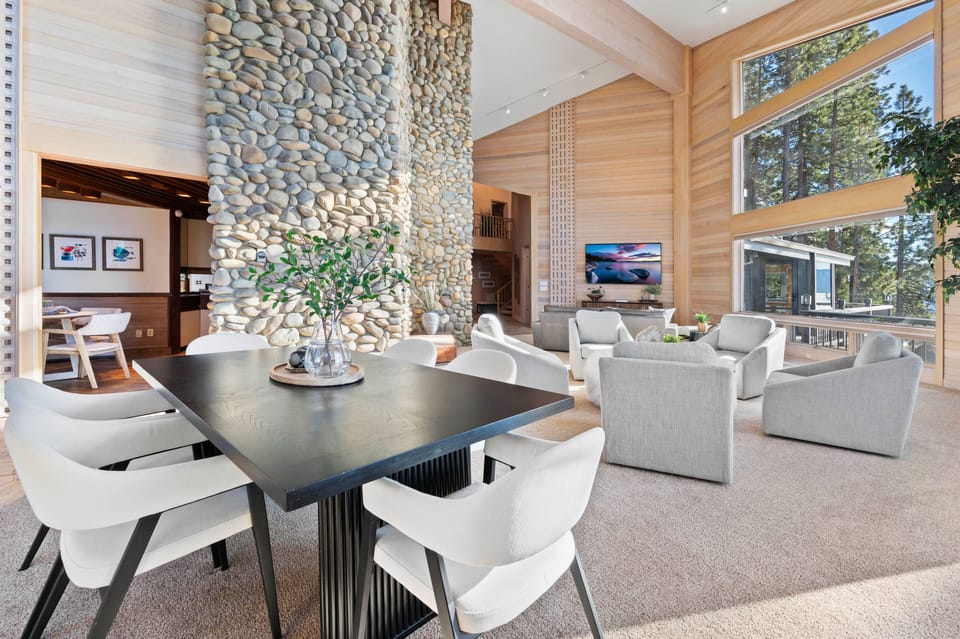 The rock fireplace separates the open living area from the kitchen & nook.