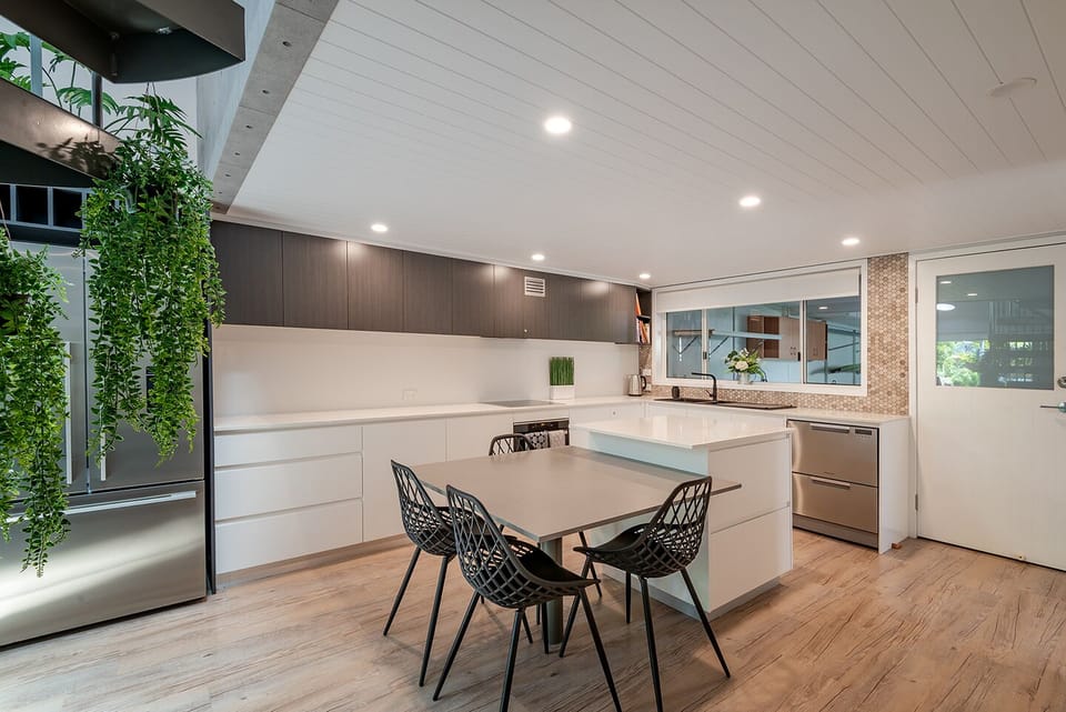 Open-plan kitchen & dining  leads into living area and has direct garage access.