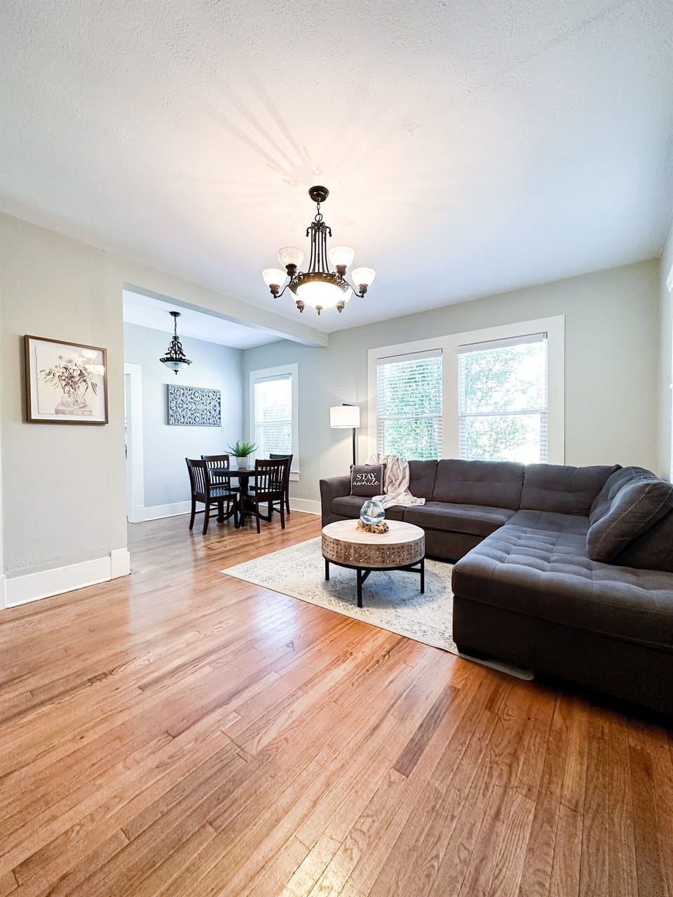 Immerse Yourself in Authentic Southern Charm: Unwind in Our Cozy Living Room Boasting Stylish Design, Influenced by the Heartwarming Hospitality of Laurel, MS - Birthplace of the Renowned HGTV Hit Show, Hometown