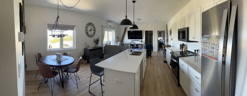 Main living space with full kitchen, and island for socializing during meal prep