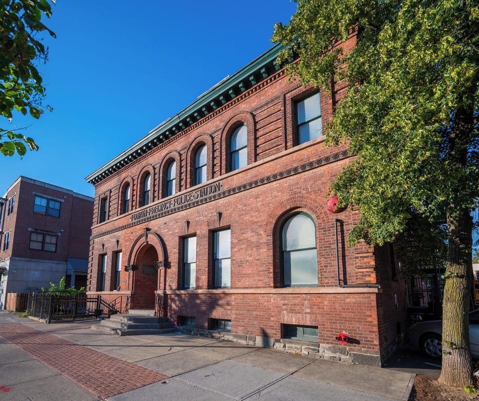 Welcome to your stay inside a historic landmark—this beautifully preserved brick building with arched windows and timeless architecture offers charm, character, and a true sense of place.