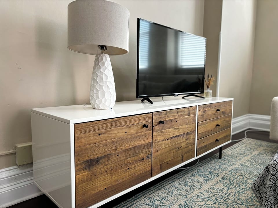 Unwind in style with a modern flat-screen TV, warm lighting, and elegant décor that bring comfort and sophistication to your stay.