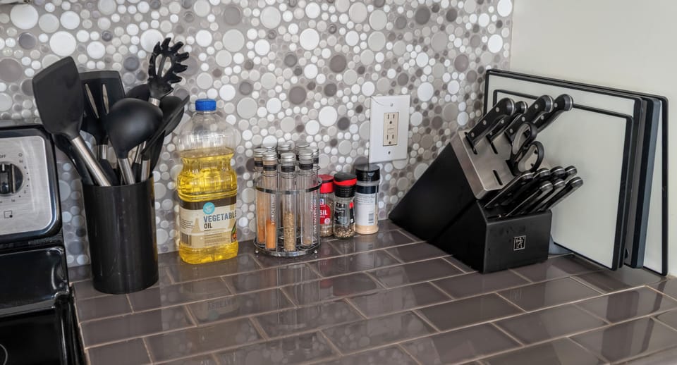 Your countertop café—Keurig with a carousel of pods, toaster, tea kettle, and creamers, so the first cup is always steps away.