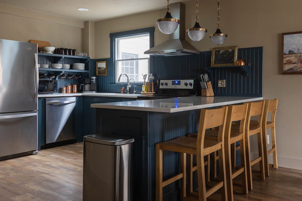 Fully stocked kitchen with room for 4 at the counter bar.
