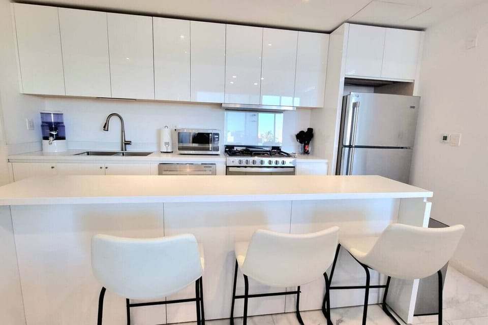Fully equipped kitchen with ample storage and high-end finishes.