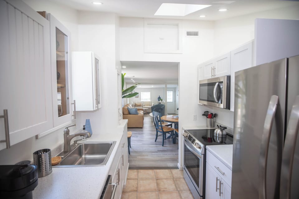 Full galley kitchen with new appliances.