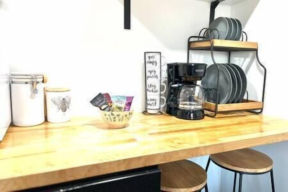 Kitchenette includes coffee pot, microwave, toaster, fridge and breakfast
