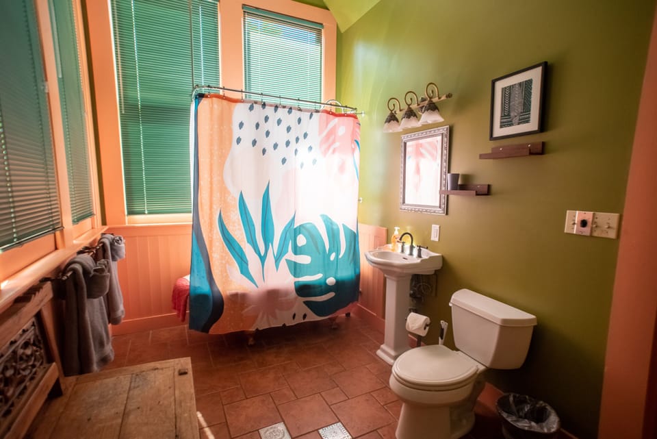 Full bathroom with clawfoot tub/shower combination