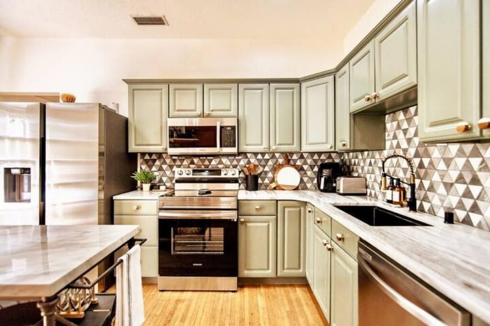 Charm mixes with function and modern - chef's dream kitchen. 