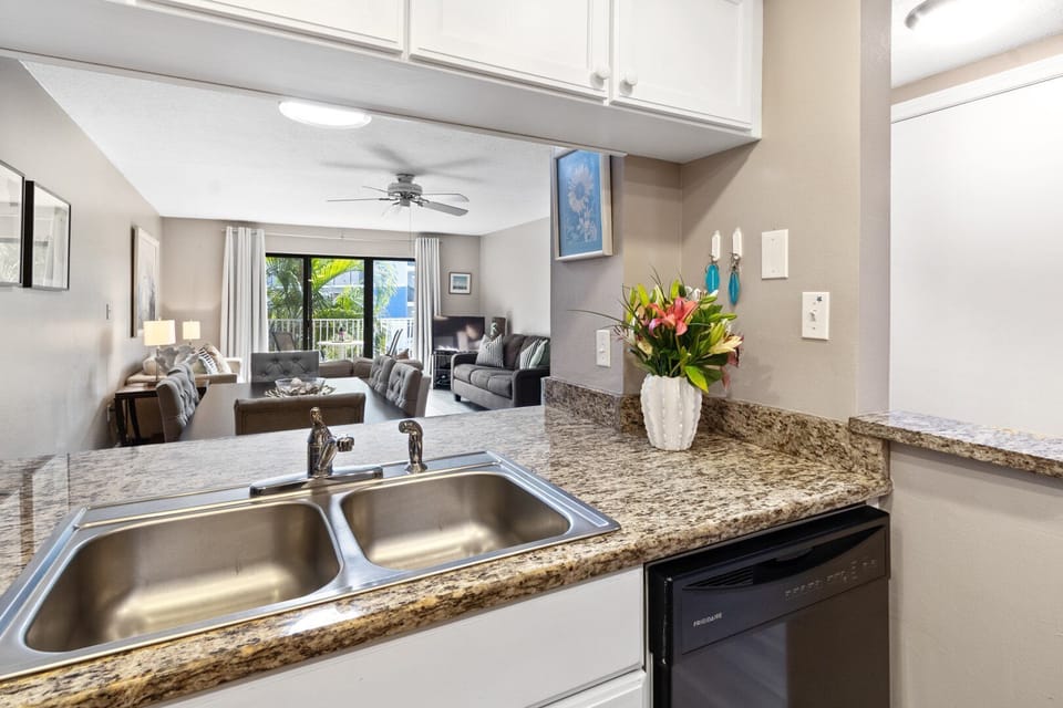 A stylish and functional kitchen with a seamless view into the living area—perfect for cooking while staying connected.