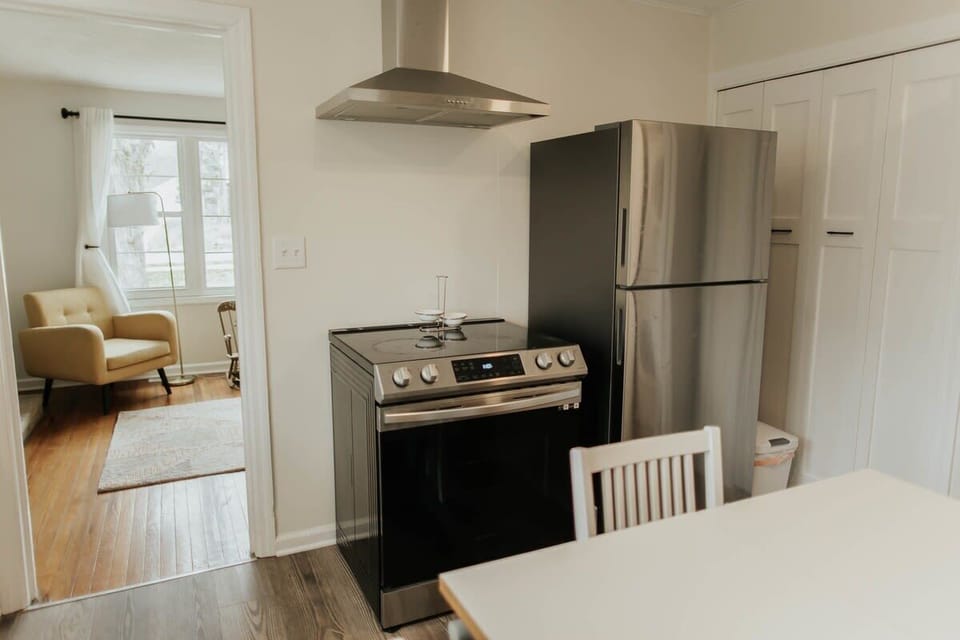 Complete your kitchen experience with a modern refrigerator and sleek range, adding both functionality and style to your culinary haven.