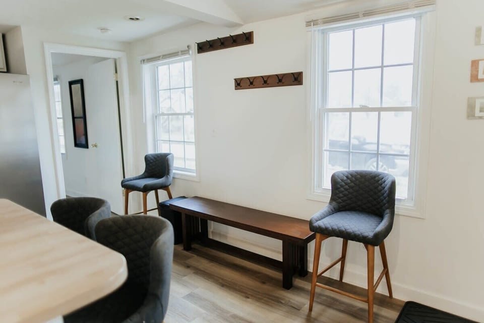 The kitchen boasts expansive windows and extra seating for your comfort and enjoyment.