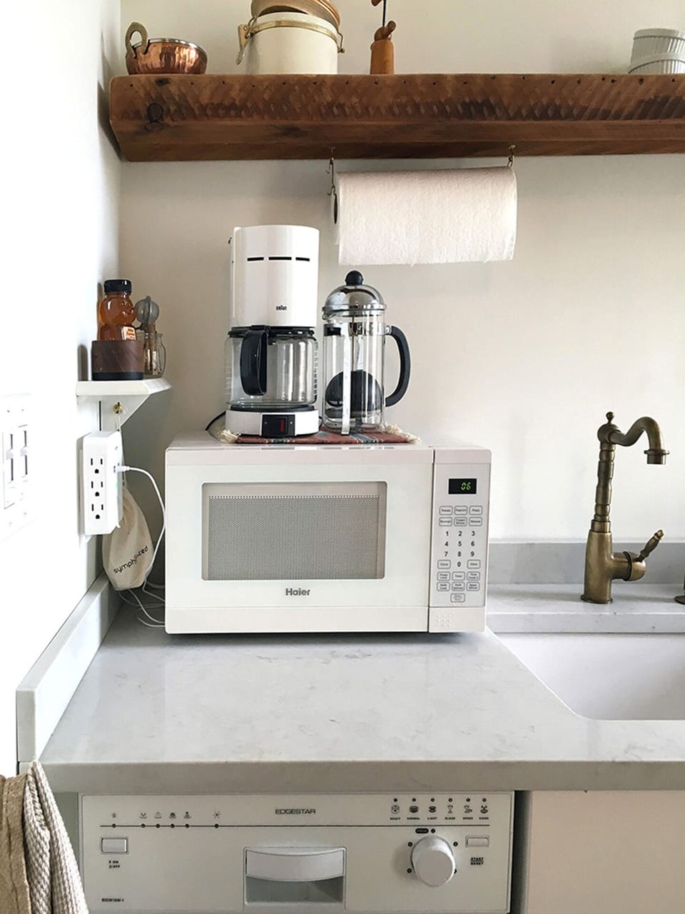 Drip coffee maker and french press, assorted teas and coffee grinder provided.