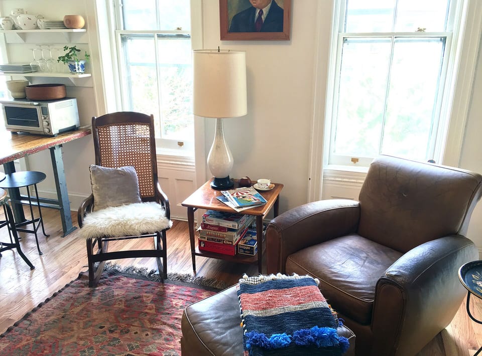 Comfortable living area with blankets and board games.