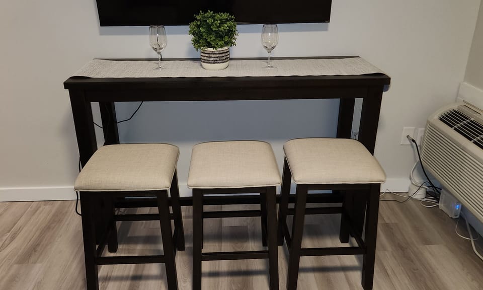 Dining table with pull out stools