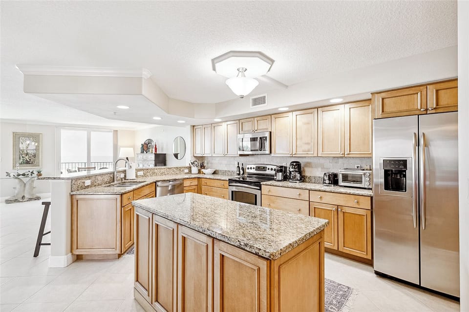 Cook and entertain in style with a spacious, wide-marbled countertop kitchen—sleek, modern, and perfect for every meal!