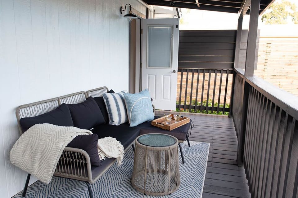 Savor the outdoors from our covered deck seating. Enjoy fresh air and scenic views in ultimate comfort.