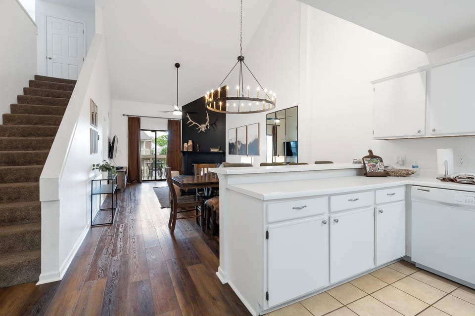 Transitional living room/dining room combo, along with breakfast bar in kitchen.