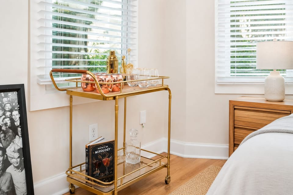 Bright bedroom corner with chic bar cart and natural light