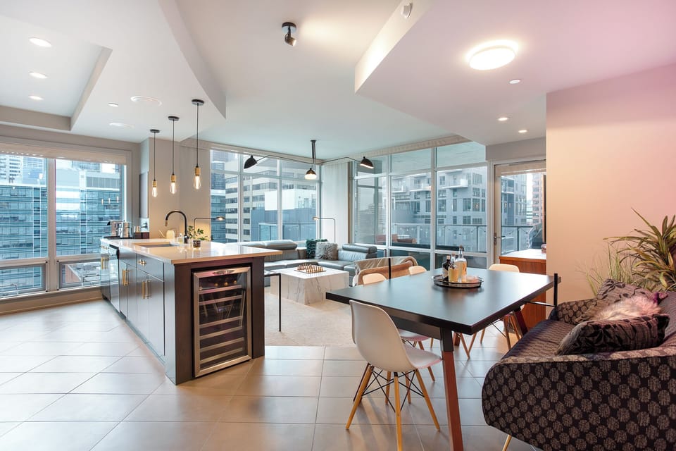 Open-Concept Kitchen, Seats 9 | Bar Fridge, DT Views, Balcony, Smart TV & Sound!