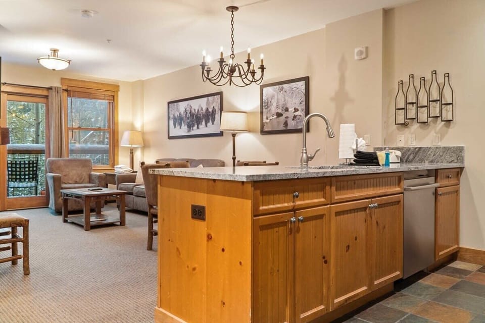The kitchen overlooks the living room/dining area creating an open and social layout great for groups to stay connected.