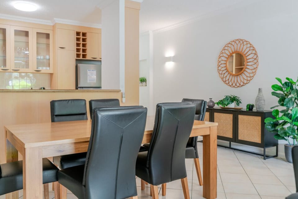 Enjoy shared meals around the bright, stylish dining table that connects beautifully to the open-plan living space.