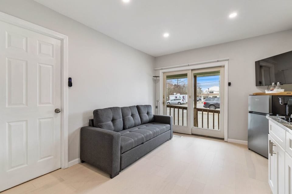 Relax in style in our open-concept living area, featuring a large Smart TV and high-speed WiFi for all your streaming needs.