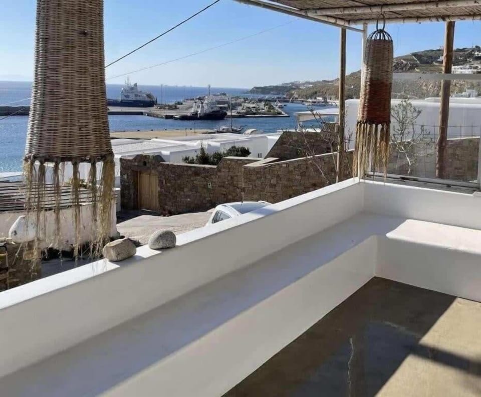 View of the patio with partial sea view and shaded seating

