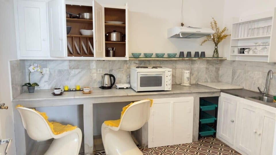 Well-Lit Kitchen Area with Modern Amenities

