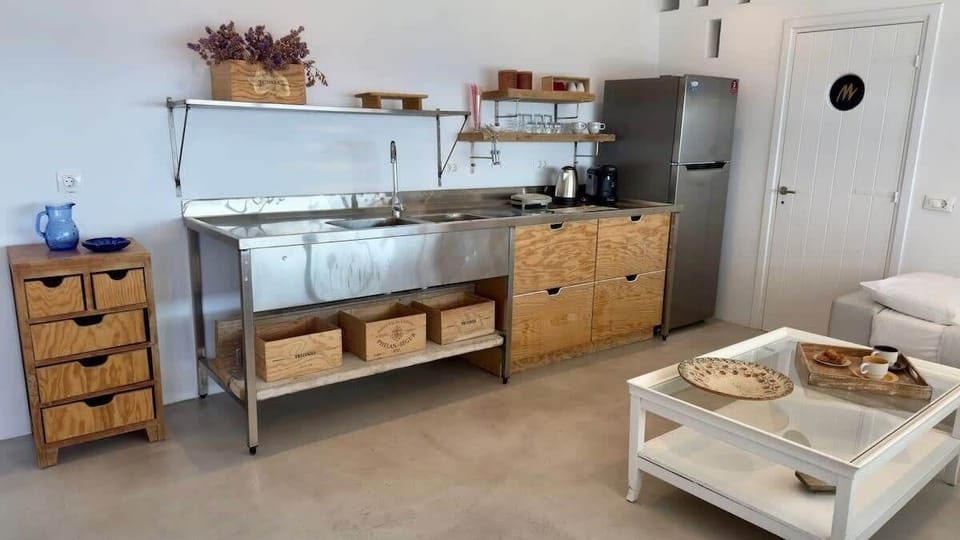 Fully equipped kitchenette with wooden accents

