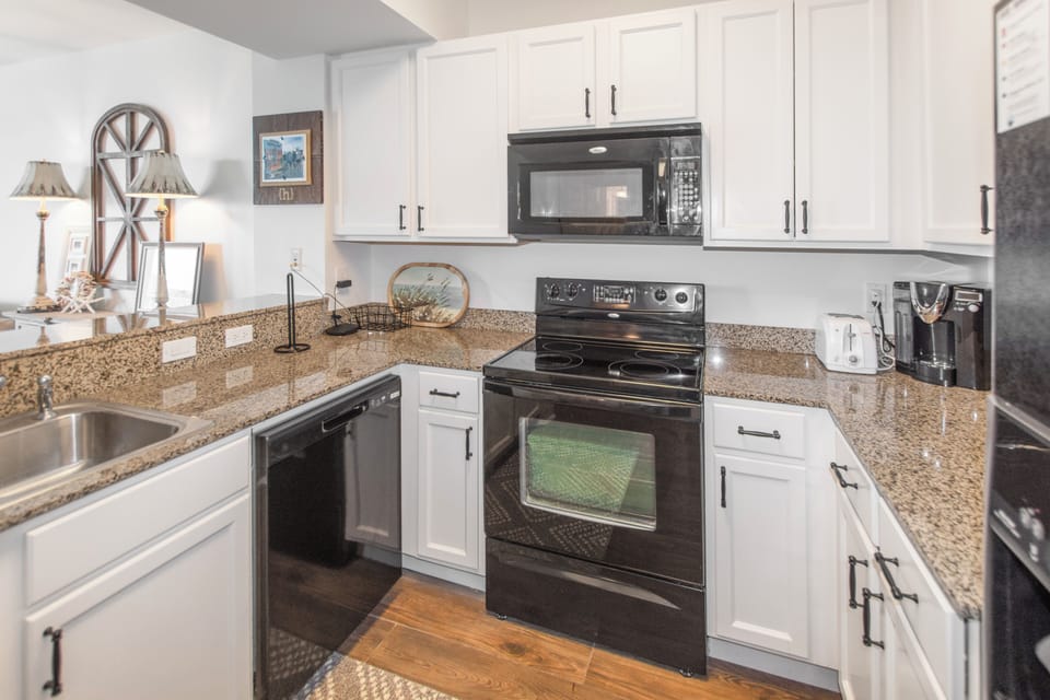 Your fully equipped kitchen features granite countertops, modern appliances, and everything you need to create memorable meals during your stay.