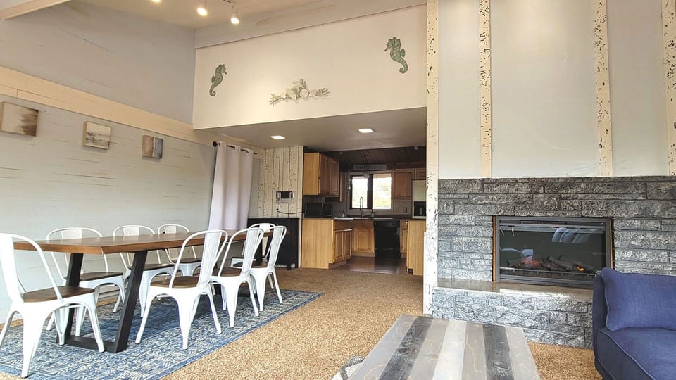 Dining area leading to the full kitchen.