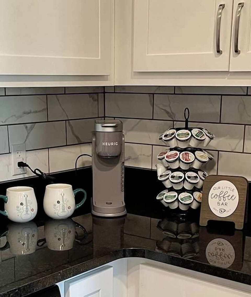 Coffee bar with a Keurig coffee maker and plenty of K-pods to get your started on your morning coffees!