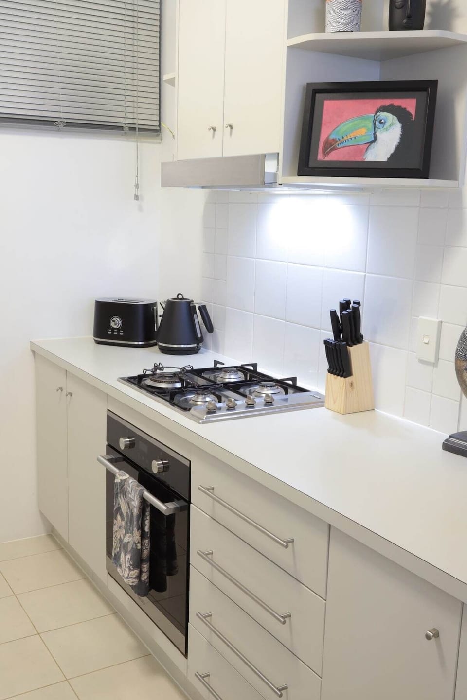 Kitchen with full-size appliances, breakfast bar, tea and coffee.