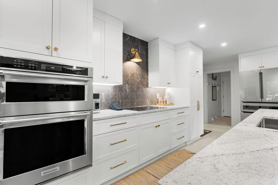 Bright, modern finishes and high-end appliances make this kitchen a true chef's delight.