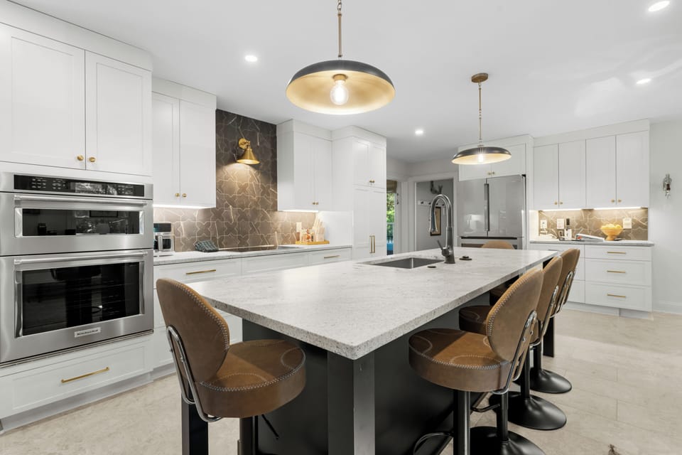 Host effortless dinners with double ovens and stylish island seating for family and friends.