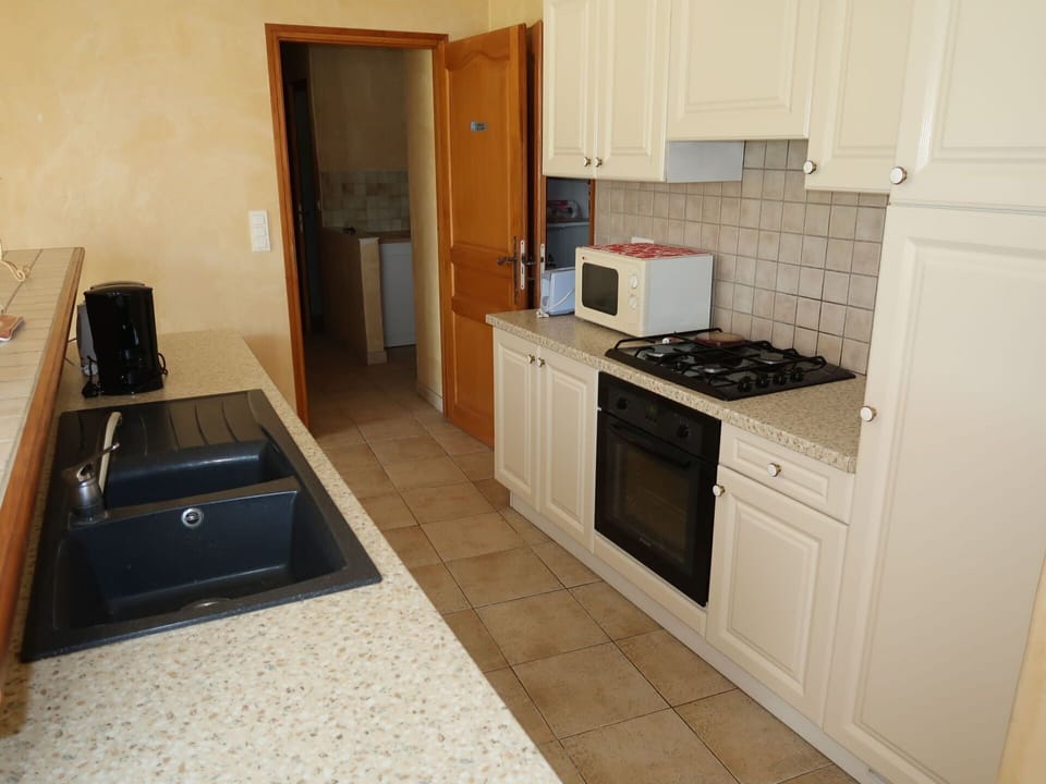 Countertop, Cabinetry, Furniture, Kitchen Sink, Kitchen Appliance, Kitchen Stove, Kitchen, Cooktop, Home Appliance, Gas Stove