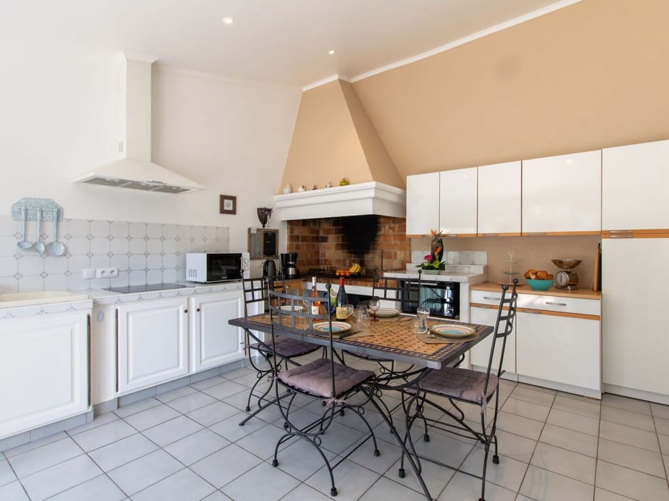 Cabinetry, Countertop, Furniture, Kitchen Appliance, Kitchen Stove, Table, Home Appliance, Kitchen, Wood, Interior Design