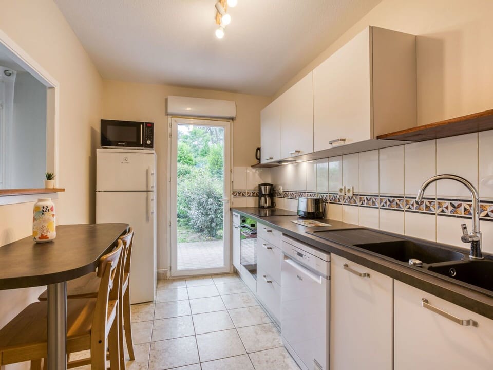 Countertop, Cabinetry, Kitchen Sink, Furniture, Window, Sink, Kitchen Appliance, Kitchen, Wood, Kitchen Stove