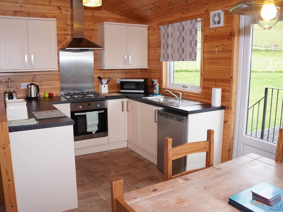 Cabinetry, Table, Furniture, Countertop, Wood, Kitchen Appliance, Kitchen Stove, Kitchen, Home Appliance, Flooring