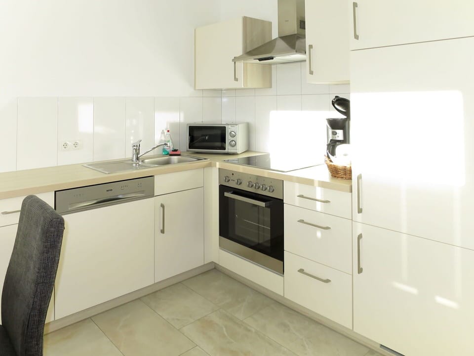 Countertop, Cabinetry, Kitchen Sink, Sink, Tap, Kitchen Stove, Kitchen Appliance, Kitchen, Building, Plumbing Fixture
