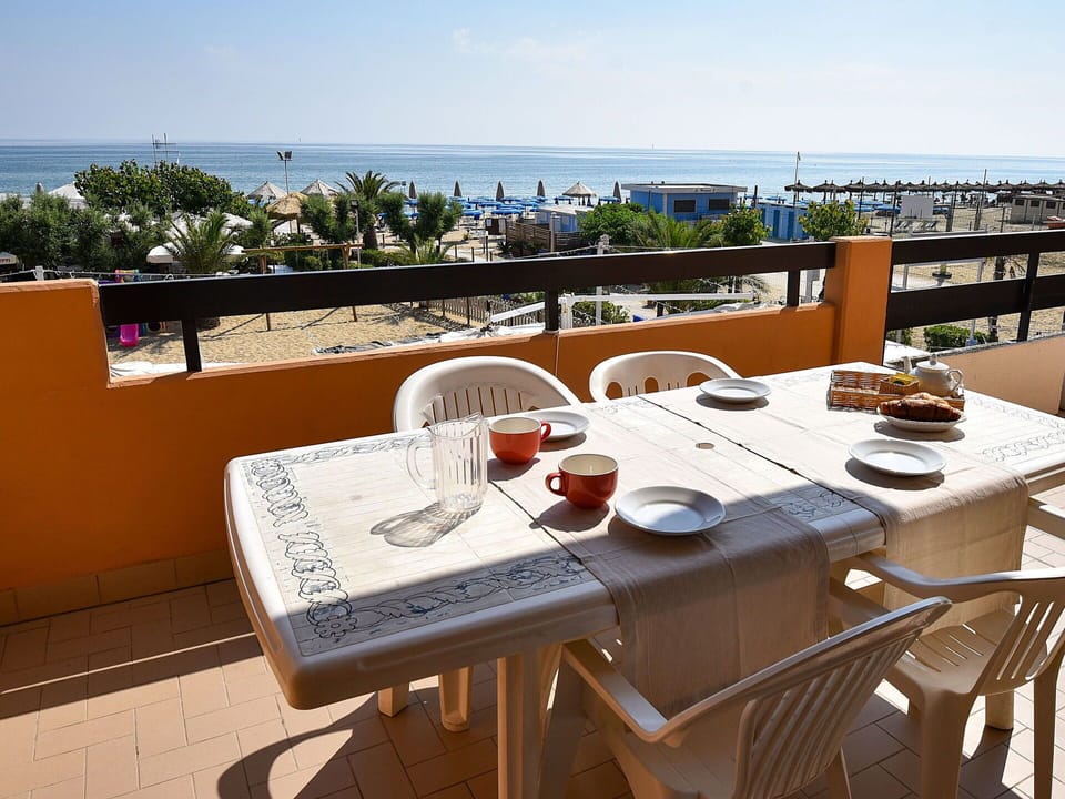 Table, Sky, Furniture, Property, Tableware, Chair, Water, Outdoor Furniture, Outdoor Table, Building
