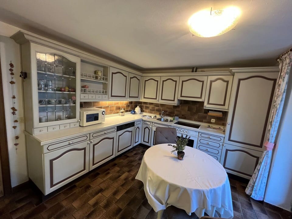 Cabinetry, Furniture, Countertop, Property, Table, Kitchen, Azure, Picture Frame, Wood, Interior Design